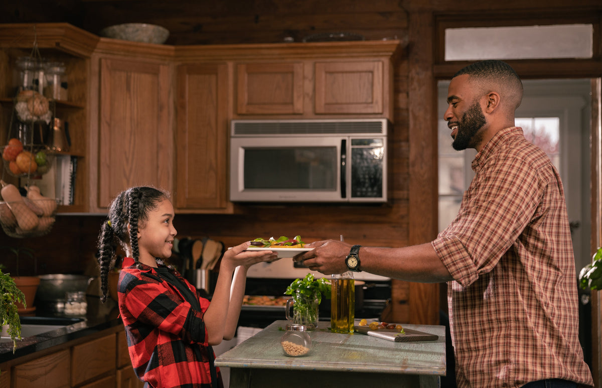 Father and Daughter Cooking Together