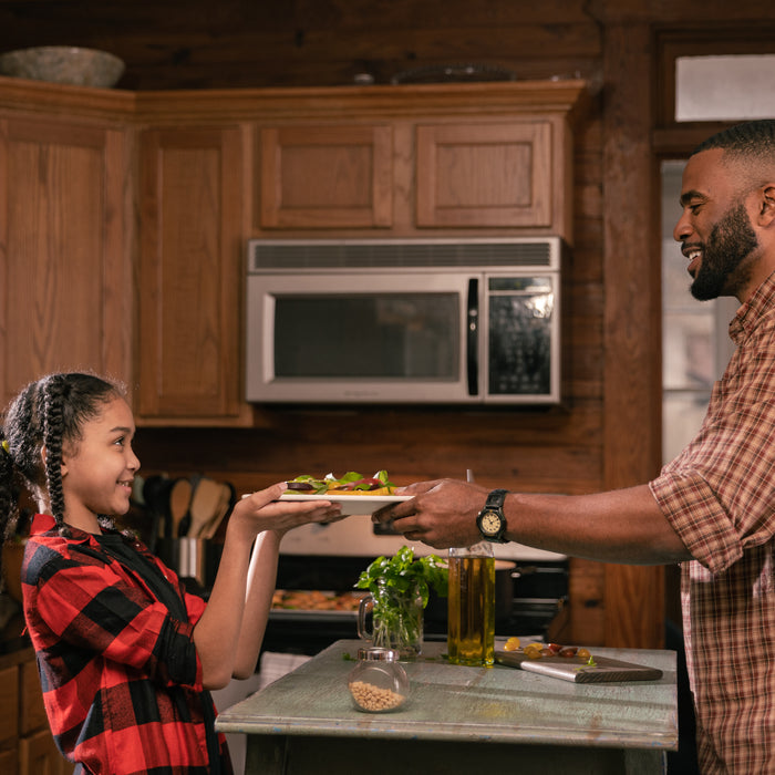 Father and Daughter Cooking Together